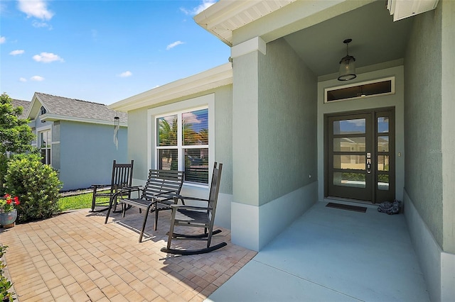 6243 Danielson Loop, The Villages, FL 32163 - property entrance with stucco siding and a porch