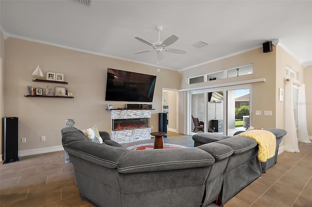 6243 Danielson Loop, The Villages, FL 32163 - living room featuring ceiling fan, crown molding, a fireplace, tile patterned floors, and baseboards