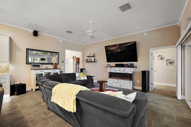 6243 Danielson Loop, The Villages, FL 32163 - tiled living room featuring crown molding, a ceiling fan, a fireplace, and baseboards