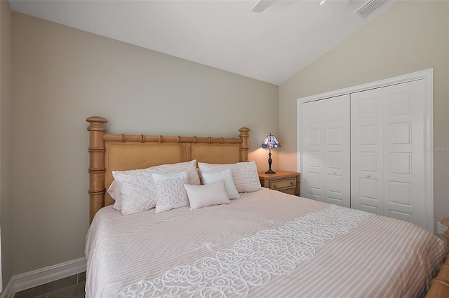 6243 Danielson Loop, The Villages, FL 32163 - bedroom featuring vaulted ceiling, a closet, baseboards, and a ceiling fan