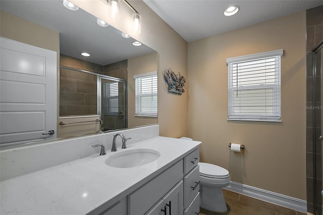 6243 Danielson Loop, The Villages, FL 32163 - full bathroom featuring tile patterned flooring, tiled shower, toilet, vanity, and baseboards