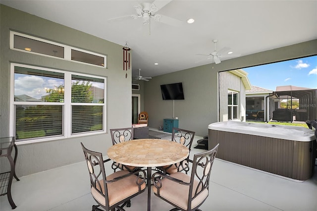 6243 Danielson Loop, The Villages, FL 32163 - view of patio / terrace featuring a hot tub, a ceiling fan, and outdoor dining space