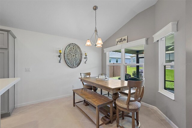 11287 Stewart Loop, Oxford, FL 34484 - dining room with lofted ceiling, plenty of natural light, light tile patterned floors, and baseboards
