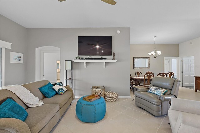 11287 Stewart Loop, Oxford, FL 34484 - living area featuring a chandelier, light tile patterned flooring, arched walkways, and baseboards