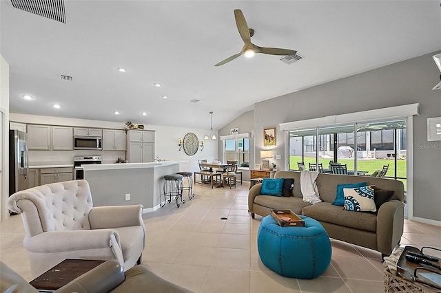 11287 Stewart Loop, Oxford, FL 34484 - living room featuring vaulted ceiling, ceiling fan, light tile patterned floors, recessed lighting, and baseboards