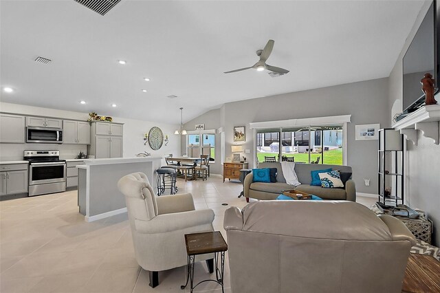 11287 Stewart Loop, Oxford, FL 34484 - living area with a ceiling fan, light tile patterned floors, recessed lighting, vaulted ceiling, and baseboards