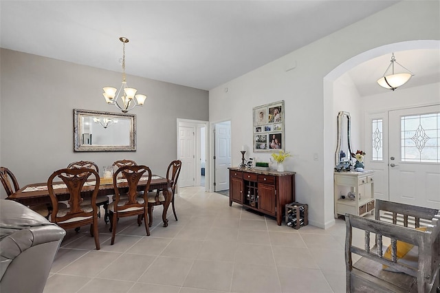11287 Stewart Loop, Oxford, FL 34484 - dining space featuring arched walkways, a chandelier, light tile patterned floors, and baseboards