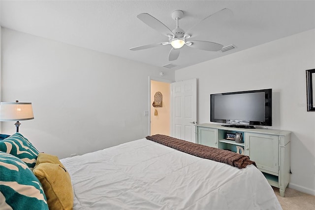 11287 Stewart Loop, Oxford, FL 34484 - bedroom featuring light colored carpet, a ceiling fan, and baseboards