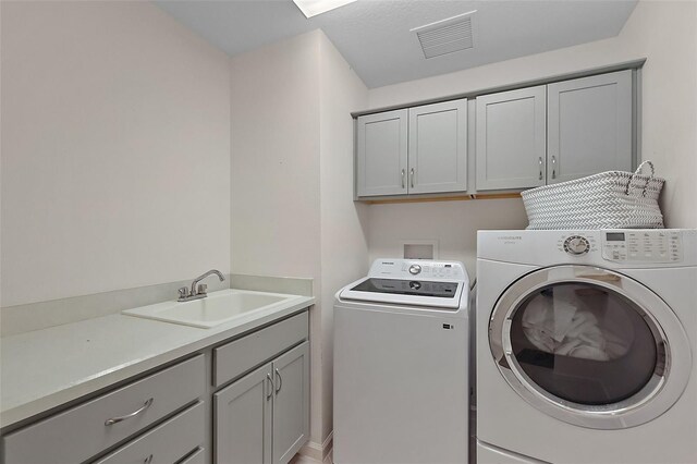 11287 Stewart Loop, Oxford, FL 34484 - laundry area featuring washer and clothes dryer and cabinet space