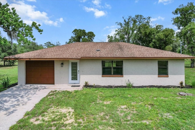 10655 N Party Ave, Dunnellon, FL 34433 - ranch-style home featuring stucco siding, a garage, a front yard, and roof with shingles