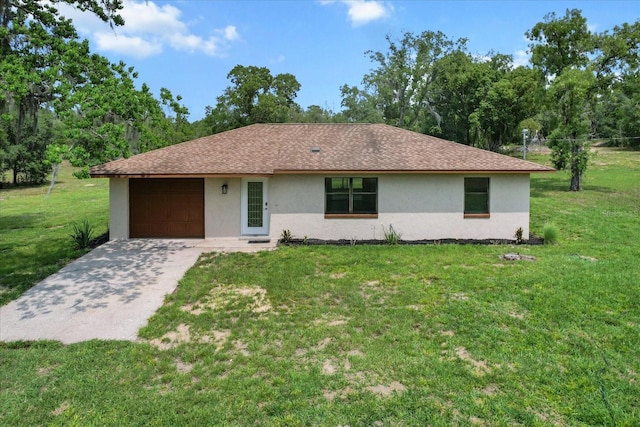 10655 N Party Ave, Dunnellon, FL 34433 - single story home featuring stucco siding, an attached garage, a front yard, and driveway