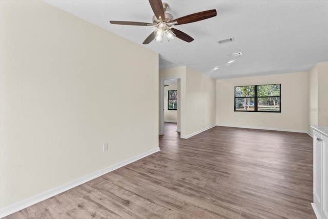 10655 N Party Ave, Dunnellon, FL 34433 - unfurnished room featuring a ceiling fan, wood finished floors, and baseboards
