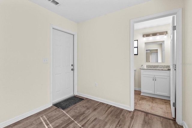 10655 N Party Ave, Dunnellon, FL 34433 - foyer with wood finished floors and baseboards
