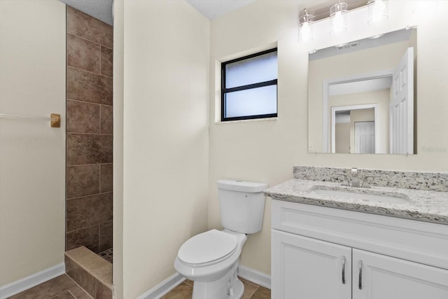 10655 N Party Ave, Dunnellon, FL 34433 - full bath with walk in shower, toilet, baseboards, vanity, and tile patterned floors