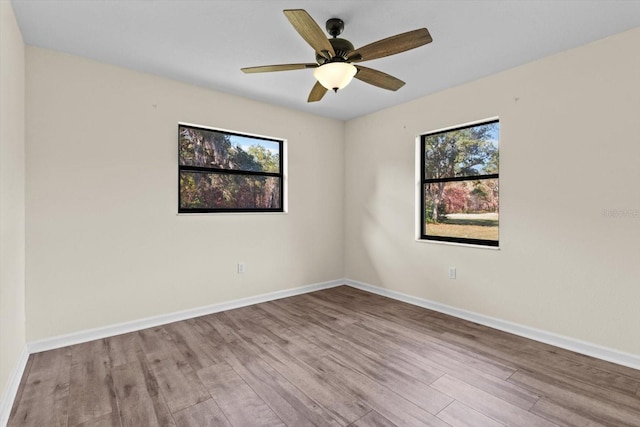 10655 N Party Ave, Dunnellon, FL 34433 - spare room featuring wood finished floors, baseboards, and ceiling fan