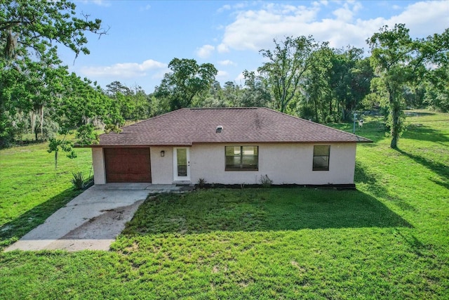 10655 N Party Ave, Dunnellon, FL 34433 - single story home featuring stucco siding, a front lawn, a garage, and driveway
