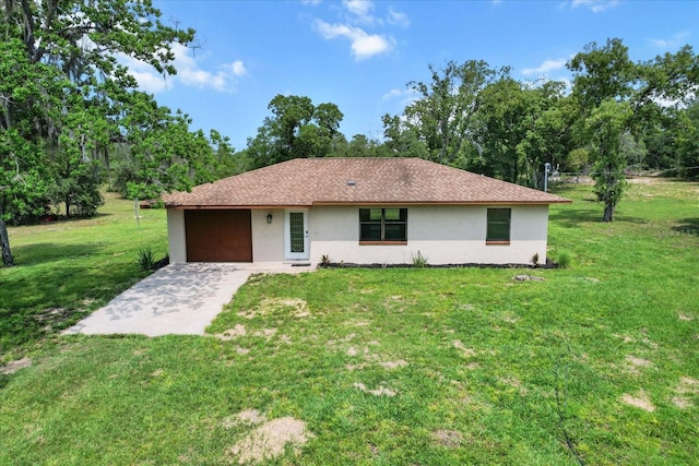 10655 N Party Ave, Dunnellon, FL 34433 - single story home with stucco siding, a garage, a front lawn, and concrete driveway