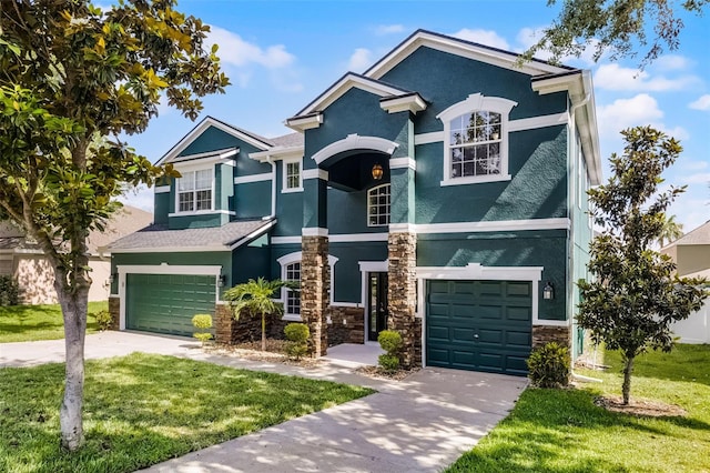 view of front of house featuring stucco siding, concrete driveway, stone siding, an attached garage, and a front lawn