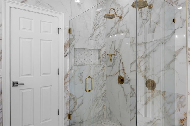 full bath with a marble finish shower