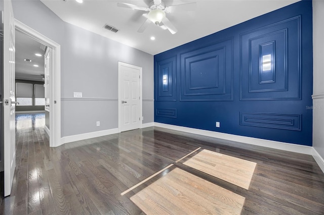 unfurnished room with ceiling fan, wood finished floors, baseboards, and recessed lighting