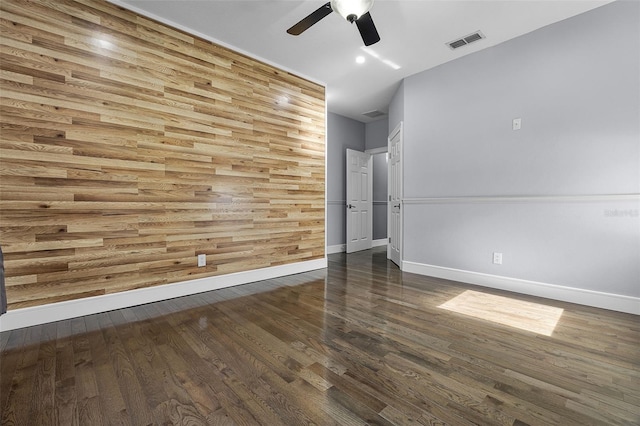 unfurnished room featuring ceiling fan, baseboards, and wood finished floors