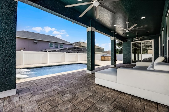 view of pool featuring ceiling fan, a fenced backyard, a patio area, and an outdoor hangout area