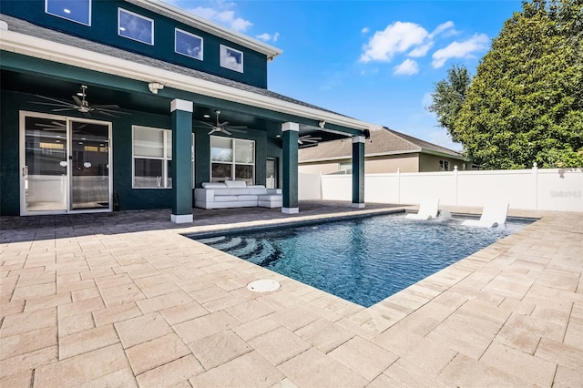 view of pool with a ceiling fan, a patio area, fence, and outdoor lounge area