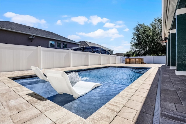view of swimming pool featuring a fenced backyard and a patio
