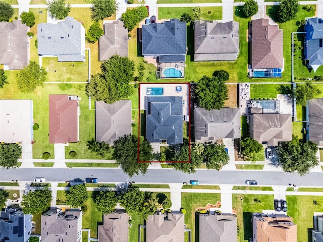 aerial view of residential area with property boundaries highlighted