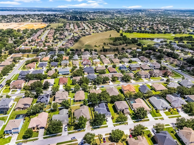view of property location featuring nearby suburban area and a nearby body of water