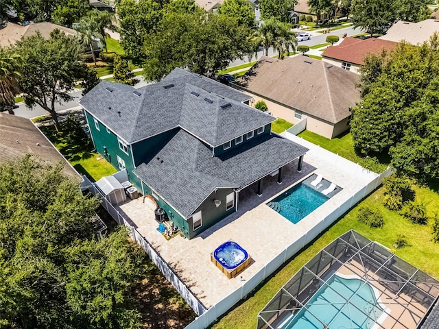 aerial perspective of suburban area with a pool area