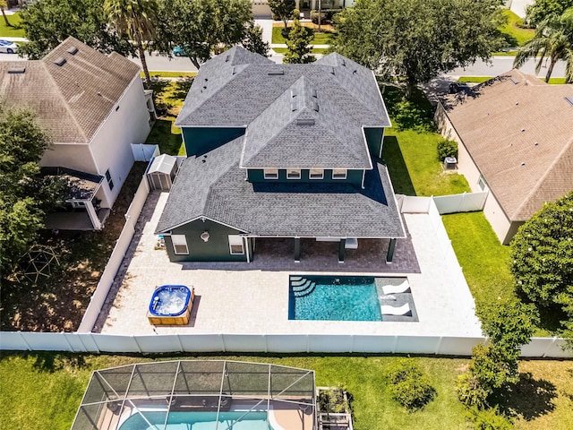 aerial view of property and surrounding area with a pool