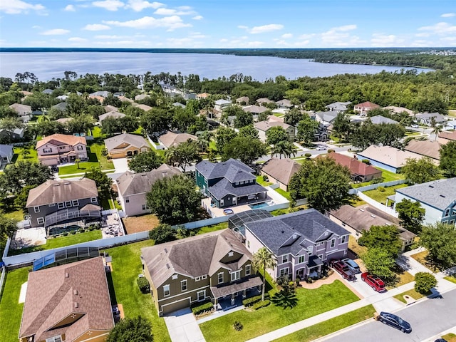 aerial view of residential area with a large body of water