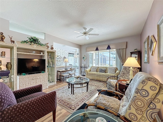 2415 Twickingham Ct, Clermont, FL 34711 - living area with wood finished floors, a textured ceiling, and ceiling fan