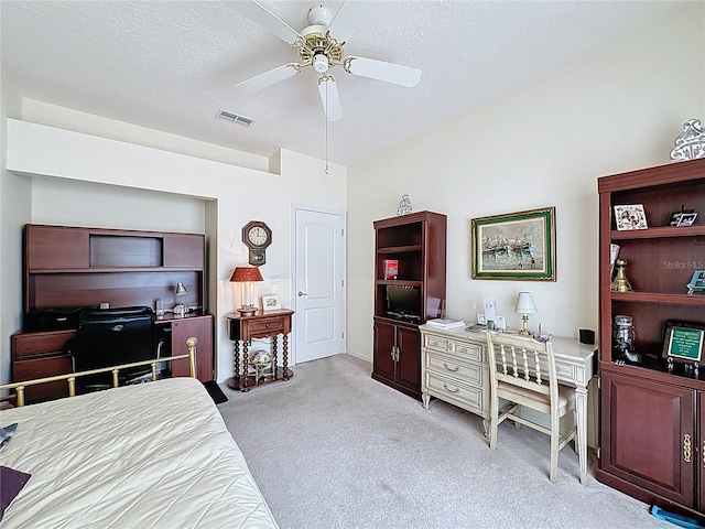 2415 Twickingham Ct, Clermont, FL 34711 - bedroom with a desk, light colored carpet, ceiling fan, and a textured ceiling