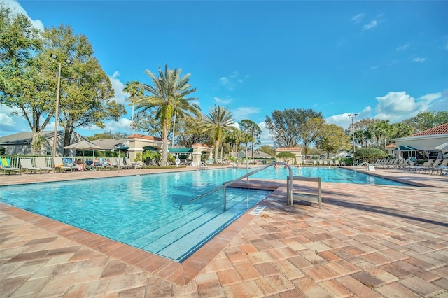 2415 Twickingham Ct, Clermont, FL 34711 - community pool featuring a patio area