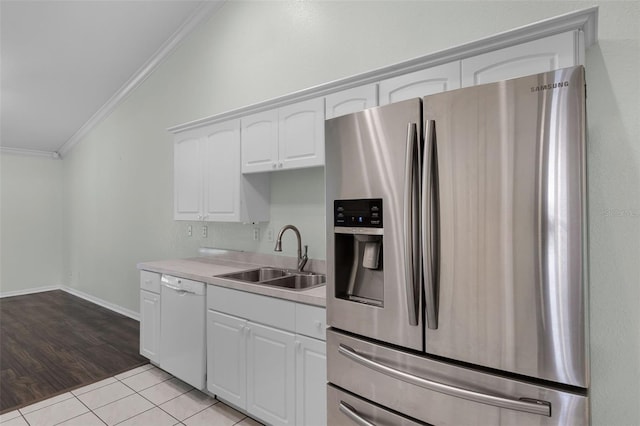 8527 Firestone Cir, Clermont, FL 34711 - kitchen featuring stainless steel refrigerator with ice dispenser, dishwasher, ornamental molding, a sink, and white cabinets