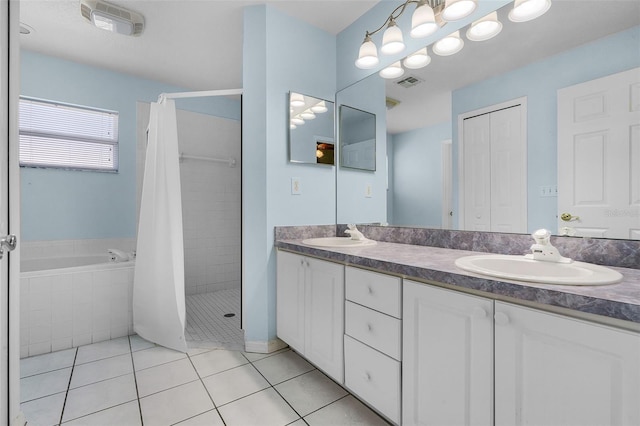 8527 Firestone Cir, Clermont, FL 34711 - bathroom featuring tile patterned flooring, a shower stall, double vanity, and a bath