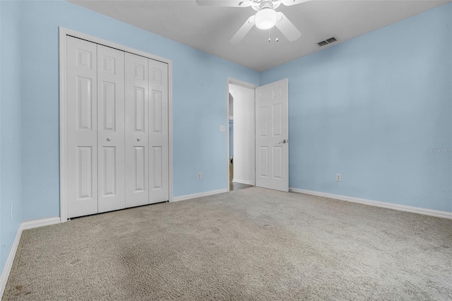 8527 Firestone Cir, Clermont, FL 34711 - unfurnished bedroom featuring carpet floors, baseboards, and a closet