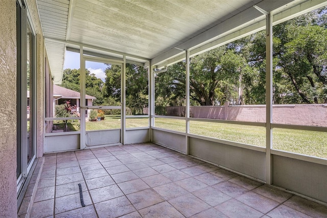 8527 Firestone Cir, Clermont, FL 34711 - unfurnished sunroom featuring view of scattered trees