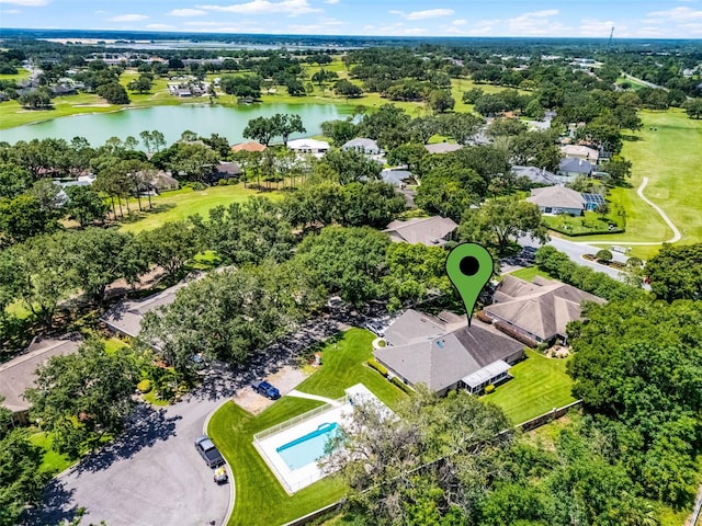 8527 Firestone Cir, Clermont, FL 34711 - aerial perspective of suburban area featuring a large body of water and a tree filled landscape