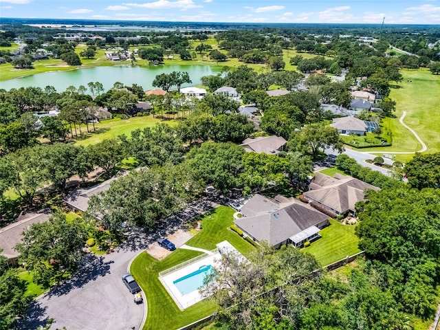 8527 Firestone Cir, Clermont, FL 34711 - aerial perspective of suburban area with a large body of water and a tree filled landscape