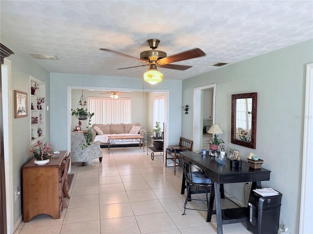 603 W Seminole Ave, Eustis, FL 32726 - dining room featuring ceiling fan and light tile patterned floors