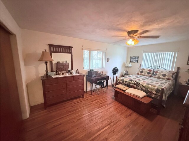 603 W Seminole Ave, Eustis, FL 32726 - bedroom with wood finished floors and ceiling fan