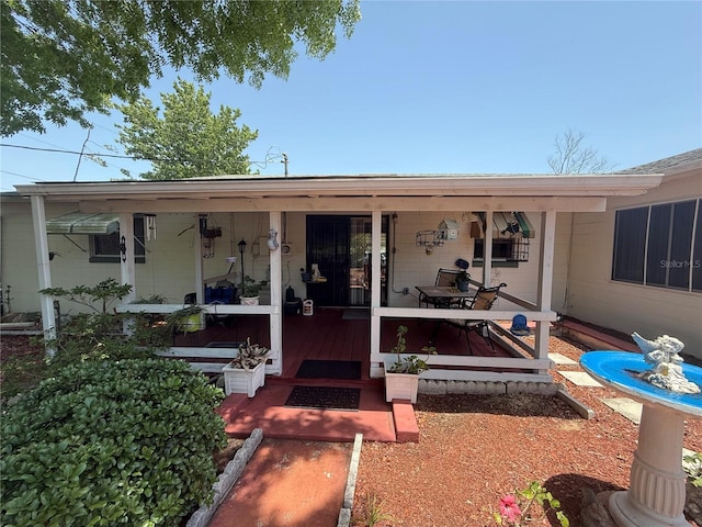 603 W Seminole Ave, Eustis, FL 32726 - property entrance with covered porch and concrete block siding