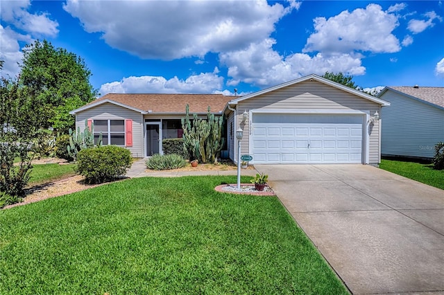 17009 SE 96th Chapelwood Cir, The Villages, FL 32162 - single story home with a front lawn, concrete driveway, and an attached garage