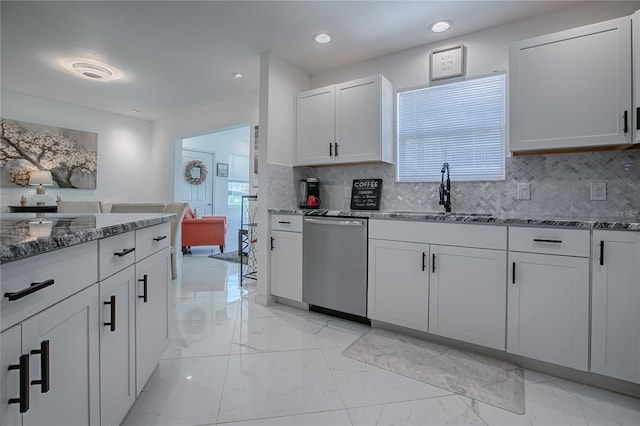 17009 SE 96th Chapelwood Cir, The Villages, FL 32162 - kitchen featuring stainless steel dishwasher, a sink, light marble finish floors, stone countertops, and decorative backsplash
