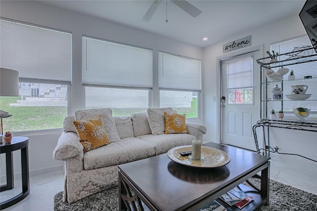17009 SE 96th Chapelwood Cir, The Villages, FL 32162 - living room with plenty of natural light, a ceiling fan, marble finish floors, baseboards, and recessed lighting
