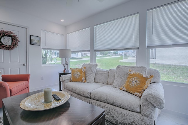 17009 SE 96th Chapelwood Cir, The Villages, FL 32162 - living room with healthy amount of natural light and baseboards