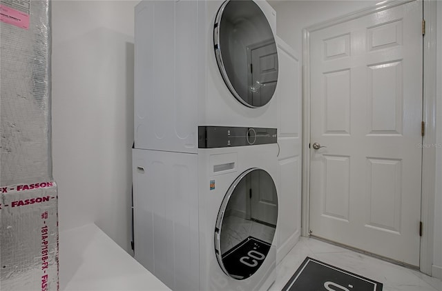 17009 SE 96th Chapelwood Cir, The Villages, FL 32162 - laundry room with estacked washer and dryer and light marble finish flooring